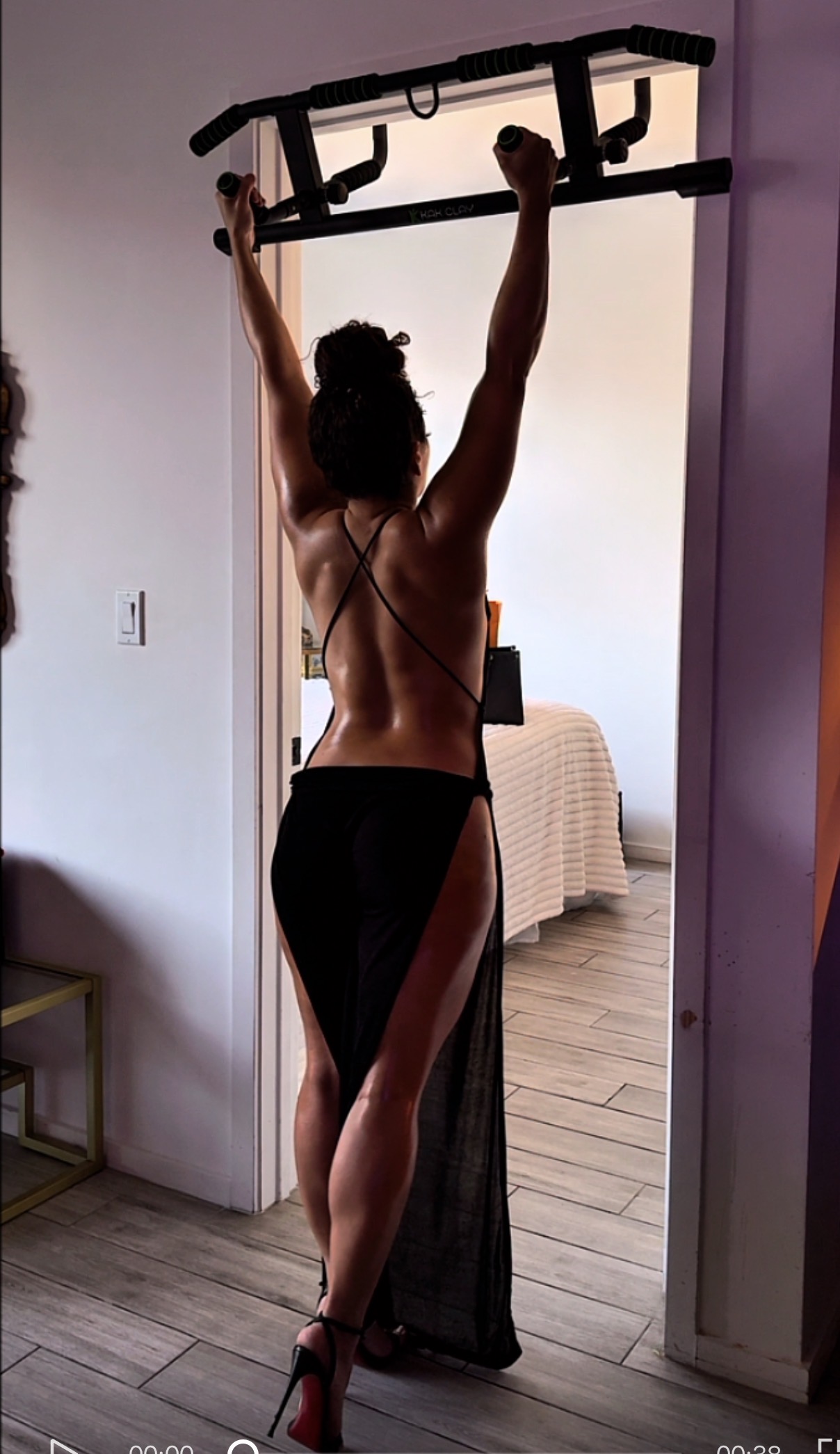 Natalie using a doorway pull-up bar