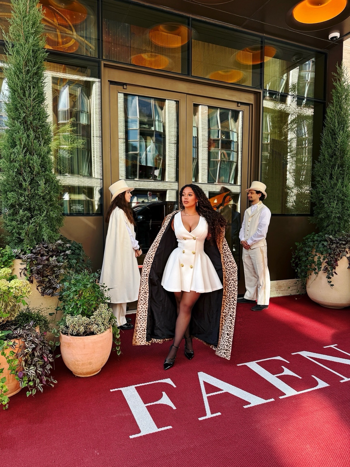 Natalie in a white tailored look at Faena