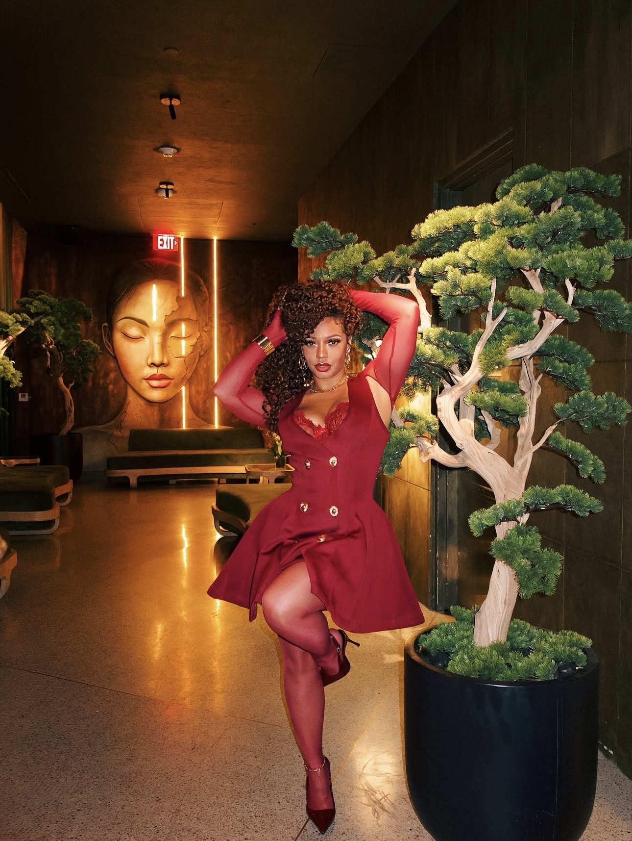 Natalie wearing a red statement dress